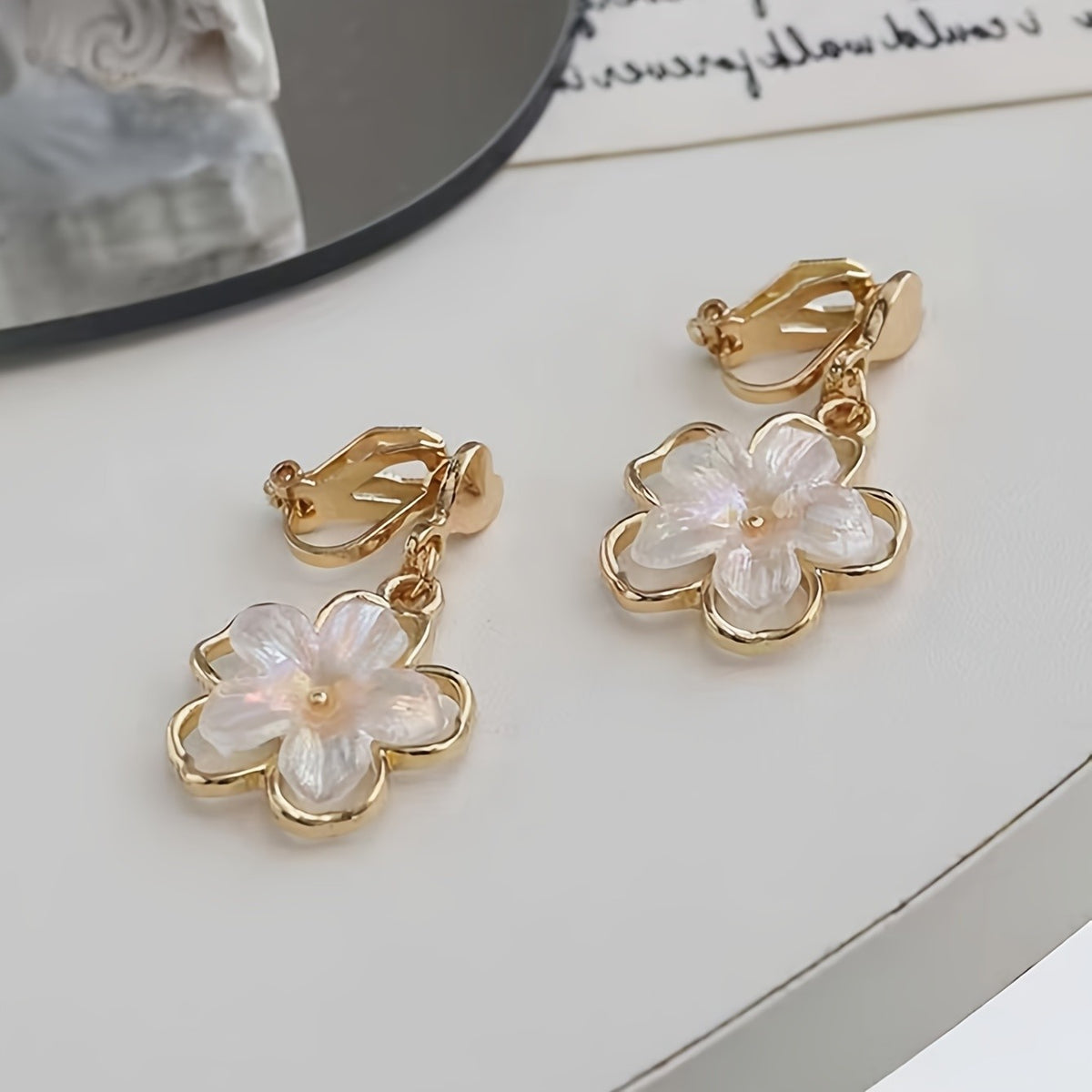 White Floral Clip-On Earrings