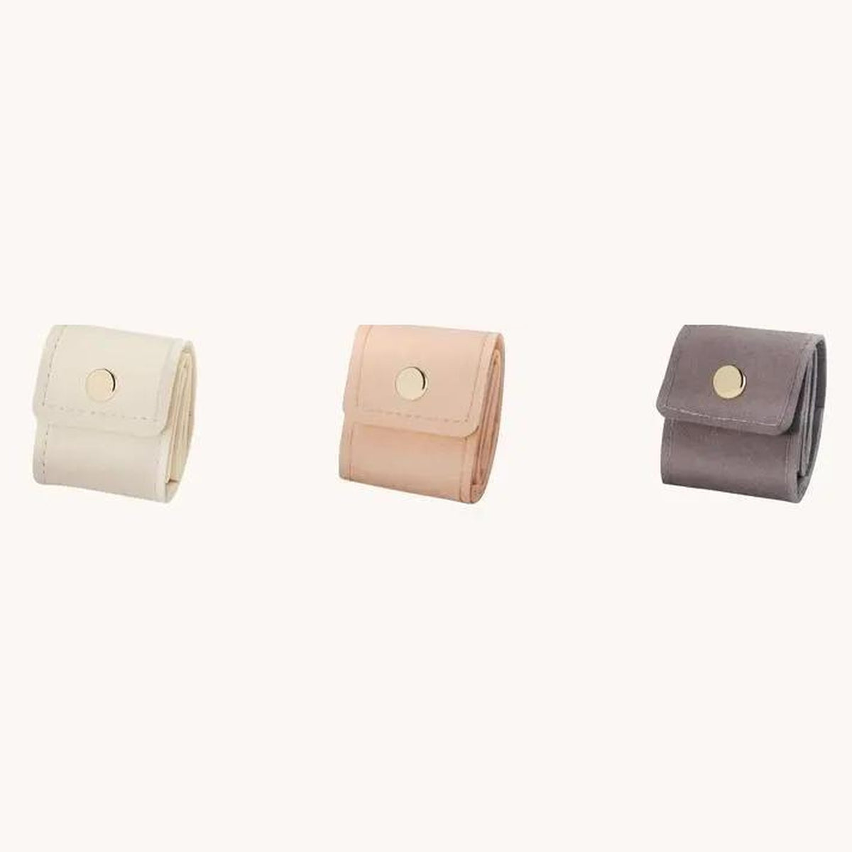 Set of 3 mini travel jewelry rolls in cream, pink and grey