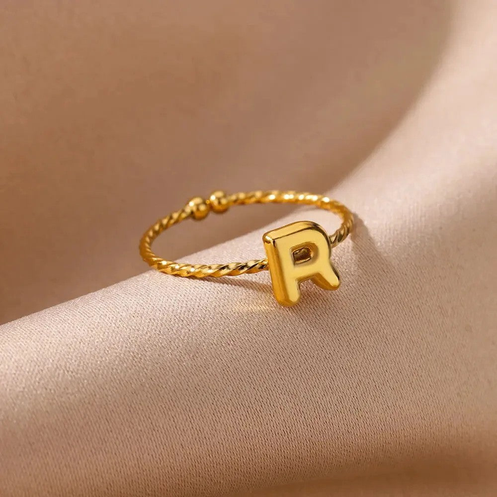 Twisted Initial Letter Ring