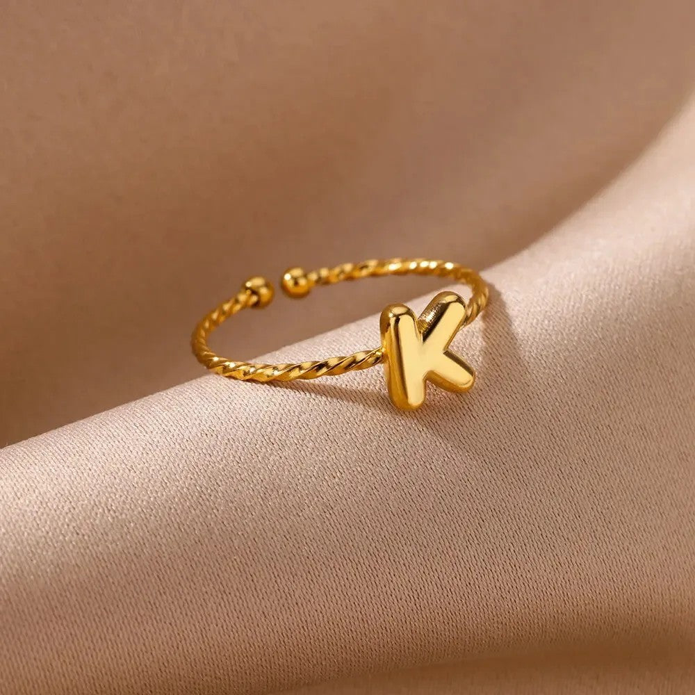 Twisted Initial Letter Ring