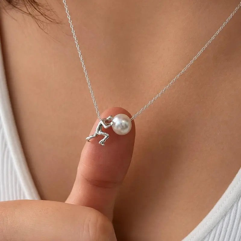 Figure Holding Pearl Necklace