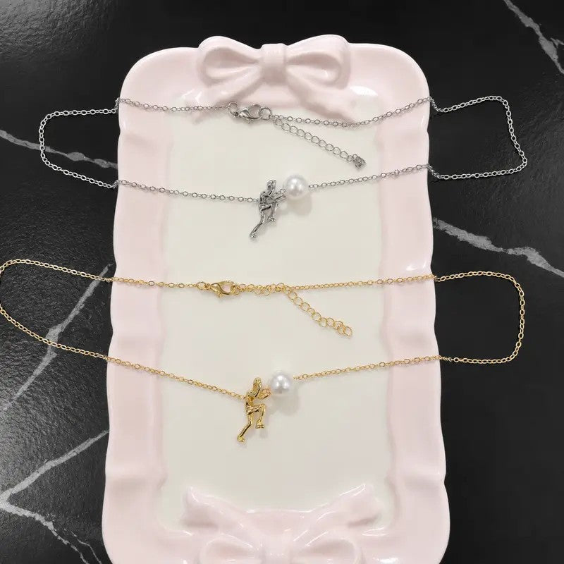 Figure Holding Pearl Necklace