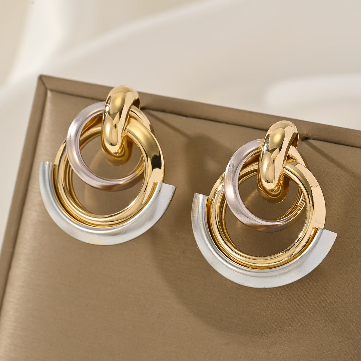 Two-Tone Interlocking Hoop Earrings
