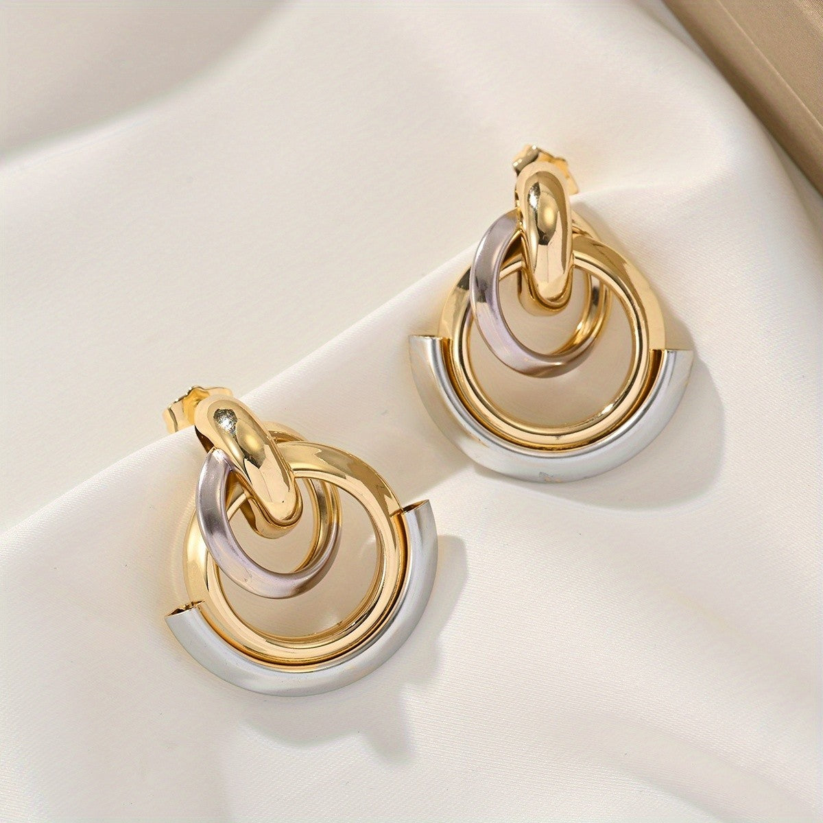 Two-Tone Interlocking Hoop Earrings