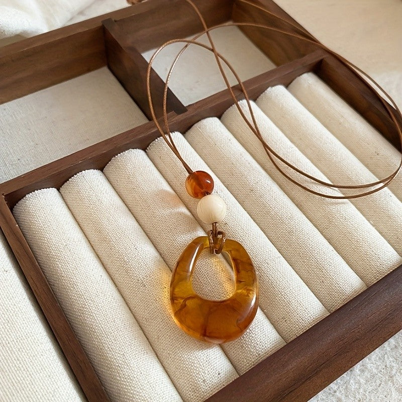 Amber Resin Hollow Oval Necklace